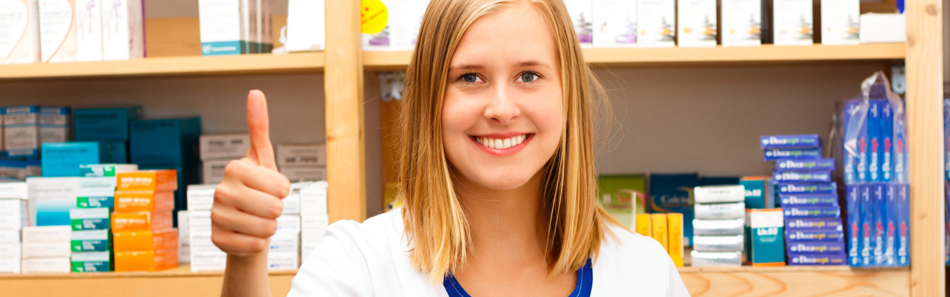 female pharmacist showing thumbs up