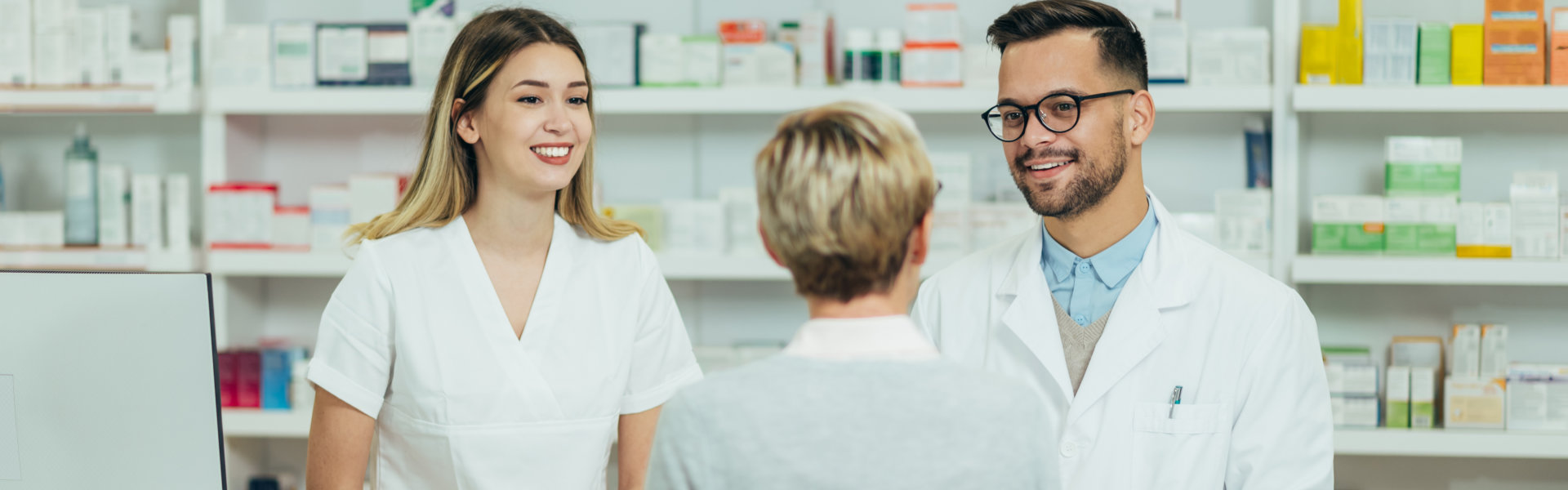 two pharmacists talking to the customer